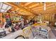 Spacious garage with wood ceiling, exposed beams, workbench, and plenty of storage at 27091 Country Oak Dr, Brooksville, FL 34602