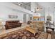 Open concept living room showcasing vaulted ceiling, fireplace, and second floor overlook at 27091 Country Oak Dr, Brooksville, FL 34602