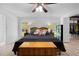Comfortable main bedroom with light wood floors, ceiling fan, and closet access at 27091 Country Oak Dr, Brooksville, FL 34602