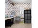 Office space featuring orange and white wallpaper, a desk, and neutral-colored carpeting at 27091 Country Oak Dr, Brooksville, FL 34602
