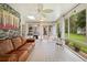 Inviting sunroom featuring tiled floors, stone accents, and an abundance of natural light at 27091 Country Oak Dr, Brooksville, FL 34602