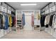 Organized walk-in closet with shelving and hanging storage for optimal storage at 27091 Country Oak Dr, Brooksville, FL 34602