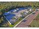 Aerial view of an RV park with mature palm trees and well-maintained grounds at 2930 Plantain Dr, Holiday, FL 34691