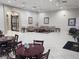 Clubhouse gathering area with comfortable seating, tiled floors, and neutral wall tones at 2930 Plantain Dr, Holiday, FL 34691