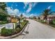 Welcoming 55+ community entrance with well-maintained landscaping and clear signage for easy navigation at 2930 Plantain Dr, Holiday, FL 34691