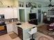 Contemporary kitchen with white cabinets open to the living area at 2930 Plantain Dr, Holiday, FL 34691