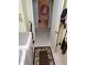 Tile-floor laundry room offering side-by-side appliances and access to a bathroom at 2930 Plantain Dr, Holiday, FL 34691
