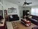 Relaxing living room with two sofas, ceiling fan, and lots of wall decor at 2930 Plantain Dr, Holiday, FL 34691