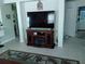 Open concept living room featuring tile flooring and a TV console at 2930 Plantain Dr, Holiday, FL 34691