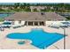 Aerial view of community pool with hot tub and plenty of lounge seating at 2930 Plantain Dr, Holiday, FL 34691