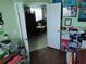 Open doorway leading into a living room from the crafting space with ample material at 2930 Plantain Dr, Holiday, FL 34691