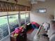 Bright sunroom filled with natural light and cozy seating, great for relaxation at 2930 Plantain Dr, Holiday, FL 34691