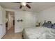 Neutral-toned bedroom with tile flooring, closet space, and soft natural light at 3140 Bahia Ave, Holiday, FL 34690