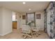Bright dining area with tile flooring, a glass table and access to the outside at 3140 Bahia Ave, Holiday, FL 34690