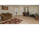 Spacious living room with tile floors, a comfortable couch, and ample natural light at 3140 Bahia Ave, Holiday, FL 34690