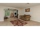 Comfortable living room with tile flooring, cozy seating, and bright natural light at 3140 Bahia Ave, Holiday, FL 34690