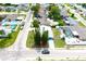 Overhead view of home with mature trees and neighborhood at 3151 Wellington Dr, Holiday, FL 34691