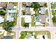 Aerial view of home in neighborhood with nearby pools at 3151 Wellington Dr, Holiday, FL 34691