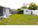 Backyard includes a utility shed and potential for gardening and outdoor activities at 3151 Wellington Dr, Holiday, FL 34691