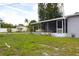 Spacious backyard offering room to add a pool or garden, with a screened in patio at 3151 Wellington Dr, Holiday, FL 34691