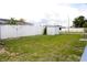 Spacious backyard with white vinyl fencing and shed at 3151 Wellington Dr, Holiday, FL 34691