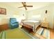 Inviting bedroom featuring neutral walls, ceiling fan and plenty of natural light at 3151 Wellington Dr, Holiday, FL 34691