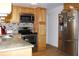 Updated kitchen featuring granite countertops and stainless steel appliances, and wood floors at 3151 Wellington Dr, Holiday, FL 34691