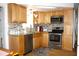 Modern kitchen with stainless steel appliances, beautiful cabinets and backsplash at 3151 Wellington Dr, Holiday, FL 34691
