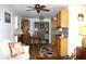 Bright living room flows into dining area and kitchen with wood floors and neutral paint at 3151 Wellington Dr, Holiday, FL 34691