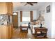 Open-concept living room with hardwood floors, neutral walls, and an abundance of natural light at 3151 Wellington Dr, Holiday, FL 34691