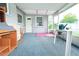 Enclosed patio with casual furniture, showcasing an accessible outdoor space with screened views at 3151 Wellington Dr, Holiday, FL 34691