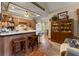 Charming kitchen with wooden cabinetry, a breakfast bar, and tile flooring at 3270 Endsley Rd, Brooksville, FL 34604