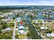 High up view showcases canal-front homes with convenient boat access to the open water, and nearby amenities at 4104 Pine Dale Ct, Hernando Beach, FL 34607