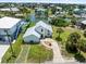 Aerial view of the home with surrounding waterways and neighborhood, showcasing waterfront living at 4104 Pine Dale Ct, Hernando Beach, FL 34607