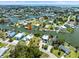 Panoramic aerial view of waterfront community with stunning coastal access, highlighting the serene lifestyle and beauty at 4104 Pine Dale Ct, Hernando Beach, FL 34607