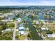 Wide aerial view of a waterfront community with extensive canals and access to open waters at 4104 Pine Dale Ct, Hernando Beach, FL 34607