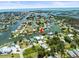 Scenic view of canal front home with dock, set in a vibrant waterfront community at 4104 Pine Dale Ct, Hernando Beach, FL 34607