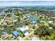 Wide aerial view of an upscale waterfront community with canals and homes, showcasing coastal living at its finest at 4104 Pine Dale Ct, Hernando Beach, FL 34607