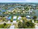Aerial view of canal-front homes with docks, featuring the convenience of waterfront living and boat access at 4104 Pine Dale Ct, Hernando Beach, FL 34607