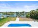 Waterfront backyard with pool, canal and boat dock at 4104 Pine Dale Ct, Hernando Beach, FL 34607