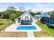 Stunning backyard view with a refreshing pool, patio, and balcony, creating an inviting outdoor oasis at 4104 Pine Dale Ct, Hernando Beach, FL 34607