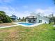 Spacious backyard with a pool and canal views at 4104 Pine Dale Ct, Hernando Beach, FL 34607