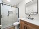 Bathroom with a glass shower and a wood vanity at 4104 Pine Dale Ct, Hernando Beach, FL 34607