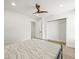 Cozy bedroom features a ceiling fan, closet and light wood flooring at 4104 Pine Dale Ct, Hernando Beach, FL 34607