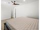 Bright bedroom with a modern ceiling fan and neutral colored plank flooring at 4104 Pine Dale Ct, Hernando Beach, FL 34607