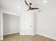 Bedroom with a light plank flooring and a modern ceiling fan at 4104 Pine Dale Ct, Hernando Beach, FL 34607