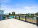 Deck overlooking the pool and water canal at 4104 Pine Dale Ct, Hernando Beach, FL 34607