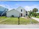 Beautiful modern home featuring a well-kept lawn, neat landscaping, and a welcoming front entrance at 4104 Pine Dale Ct, Hernando Beach, FL 34607