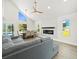 Living room boasts vaulted ceilings, fireplace, tile flooring, dining area and water views at 4104 Pine Dale Ct, Hernando Beach, FL 34607