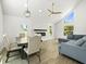 Open concept living space with a dining table, fireplace, and sectional sofa at 4104 Pine Dale Ct, Hernando Beach, FL 34607